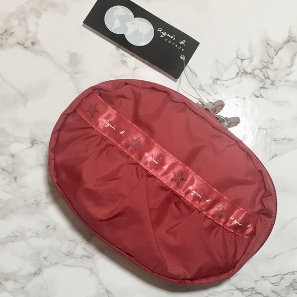 Agnes B. Handbags - NEW Agnes B Red Oval makeup bag travel pouch